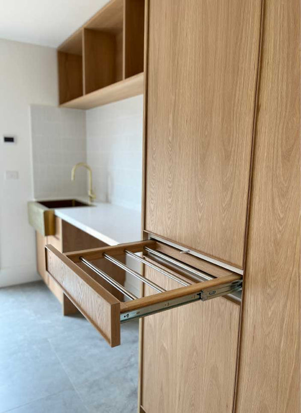 Custom Laundry Cabinetry in American Oak with Hanging Rail