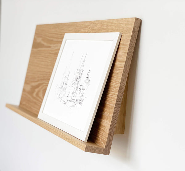 The Gallery Wall Shelf, Leaning shelf for art and photography with ledge in American Oak.  Side View