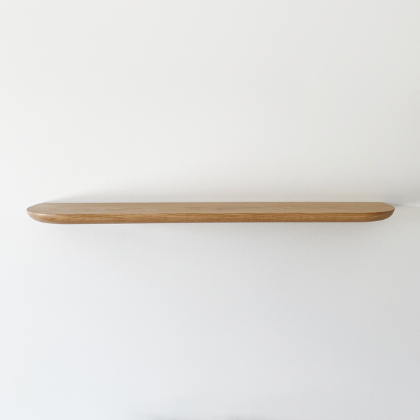 Solid American Oak Floating Timber Shelf made to order in custom sizes. Australian Made floating shelves for residential, commercial and hospitality interiors. Australian Made Floating Timber Shelves. Round Corners and Curved Profile Shelf Detail.