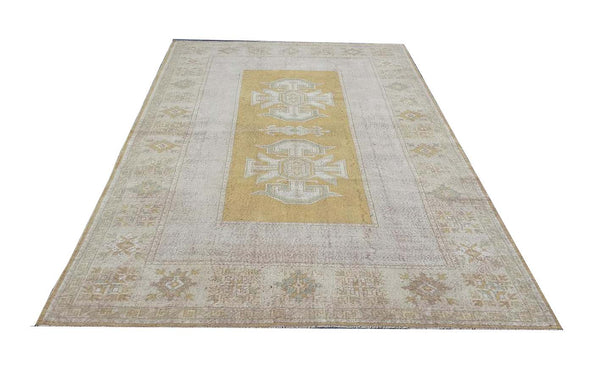 Vintage Handmade Turkish Rug with muted yellow tones and pale blue accents throughout the traditional border pattern.  Dated from the 1960's.  Traditional Vintage Turkish Rug available in Melbourne 